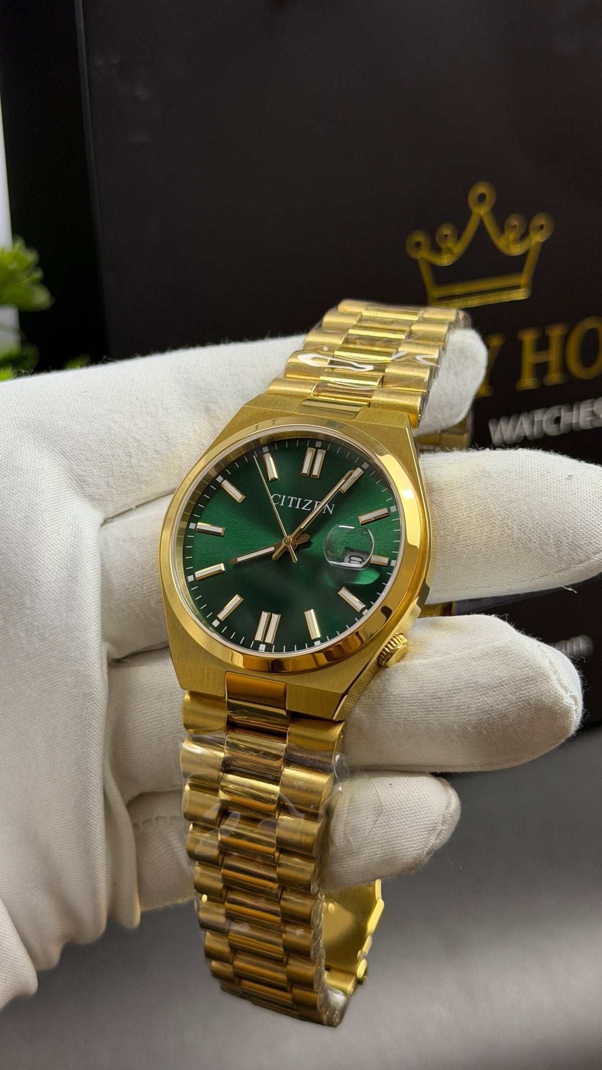 Yellow Gold with Green Dial.