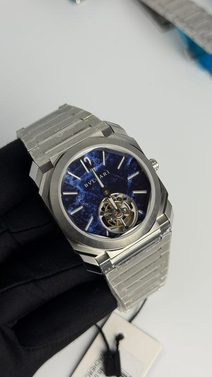 Silver with Aqua Dial.
