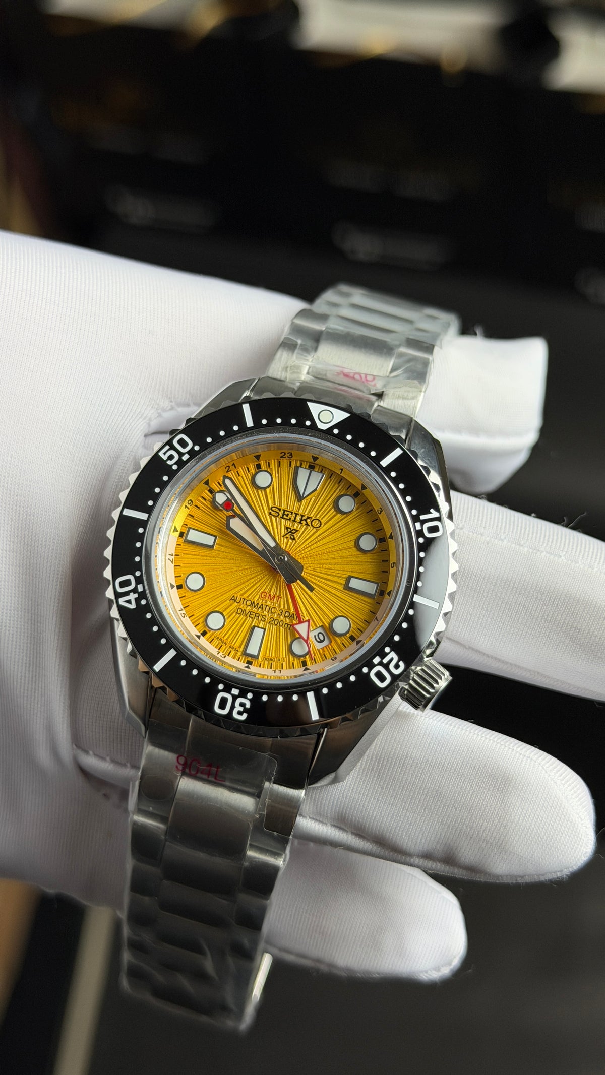 Silver with Yellow Dial.