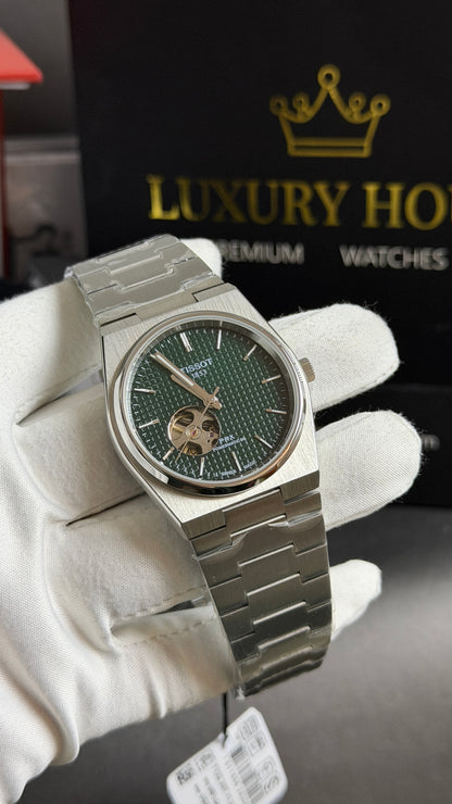 Silver with Green Dial.