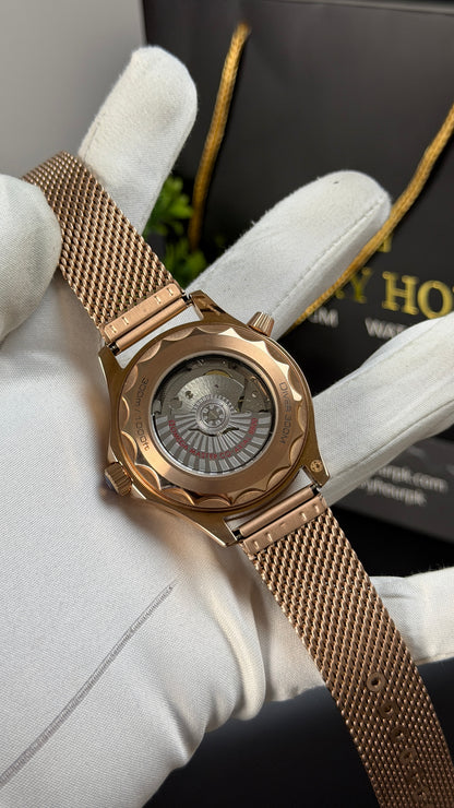 Rose Gold with Black Dial.