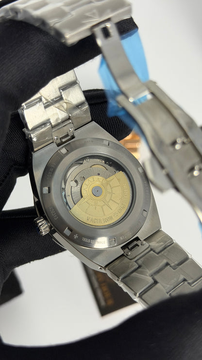 Silver with Aqua Dial.