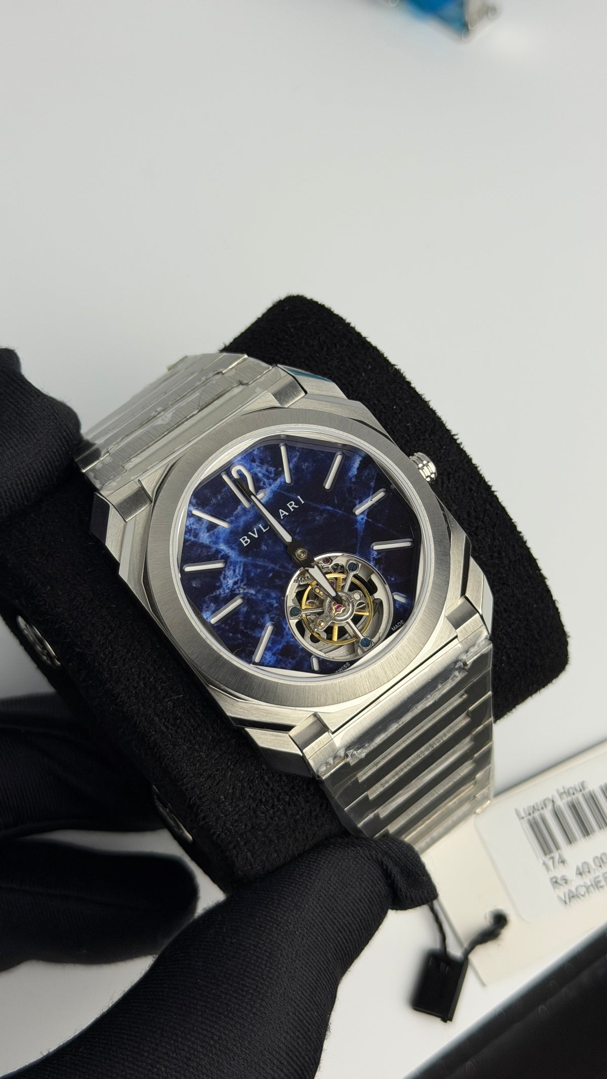 Silver with Aqua Dial.