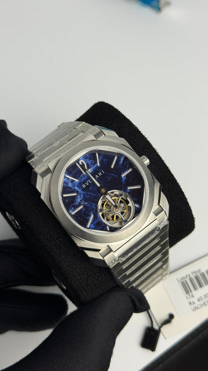 Silver with Aqua Dial.