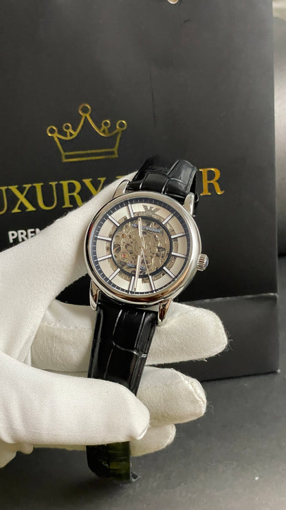 Silver with Skeleton Dial.