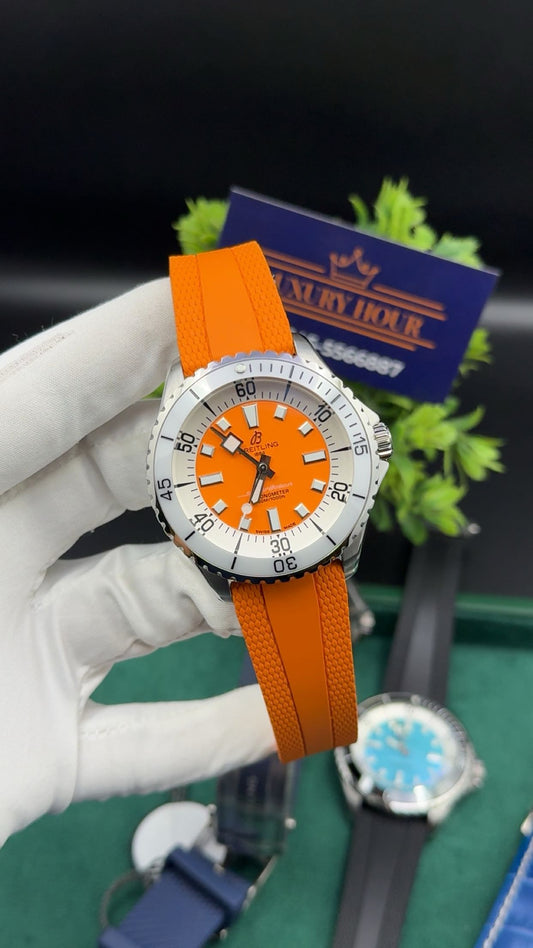 Silver with orange dial