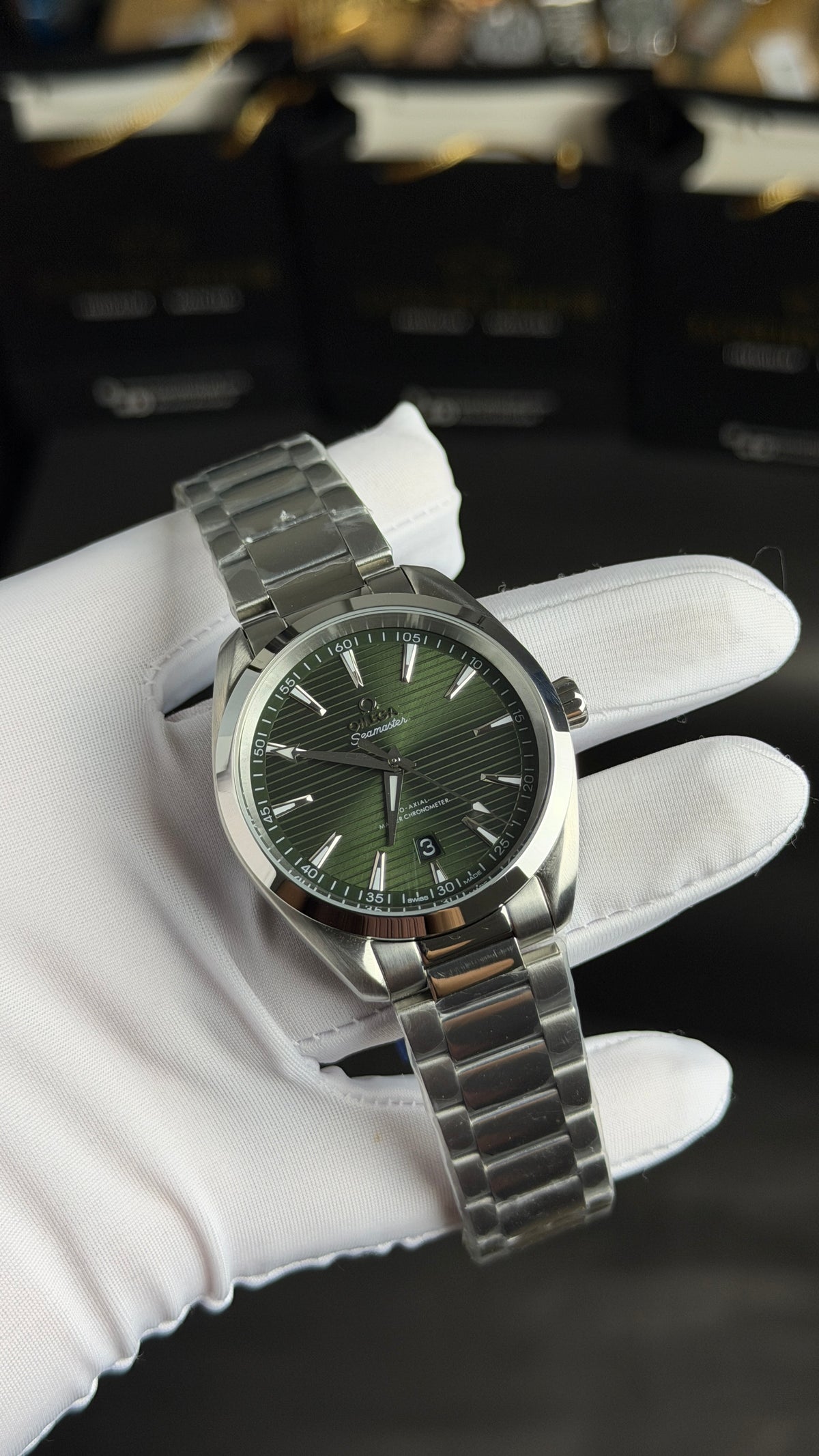 Silver with Green Dial.