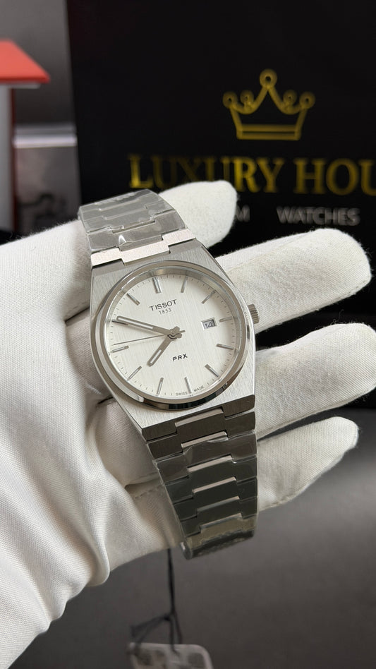 Silver with White Dial.