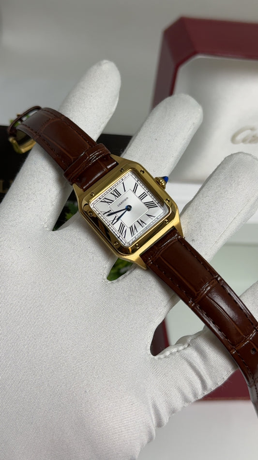 Yellow Gold with Brown Strap.