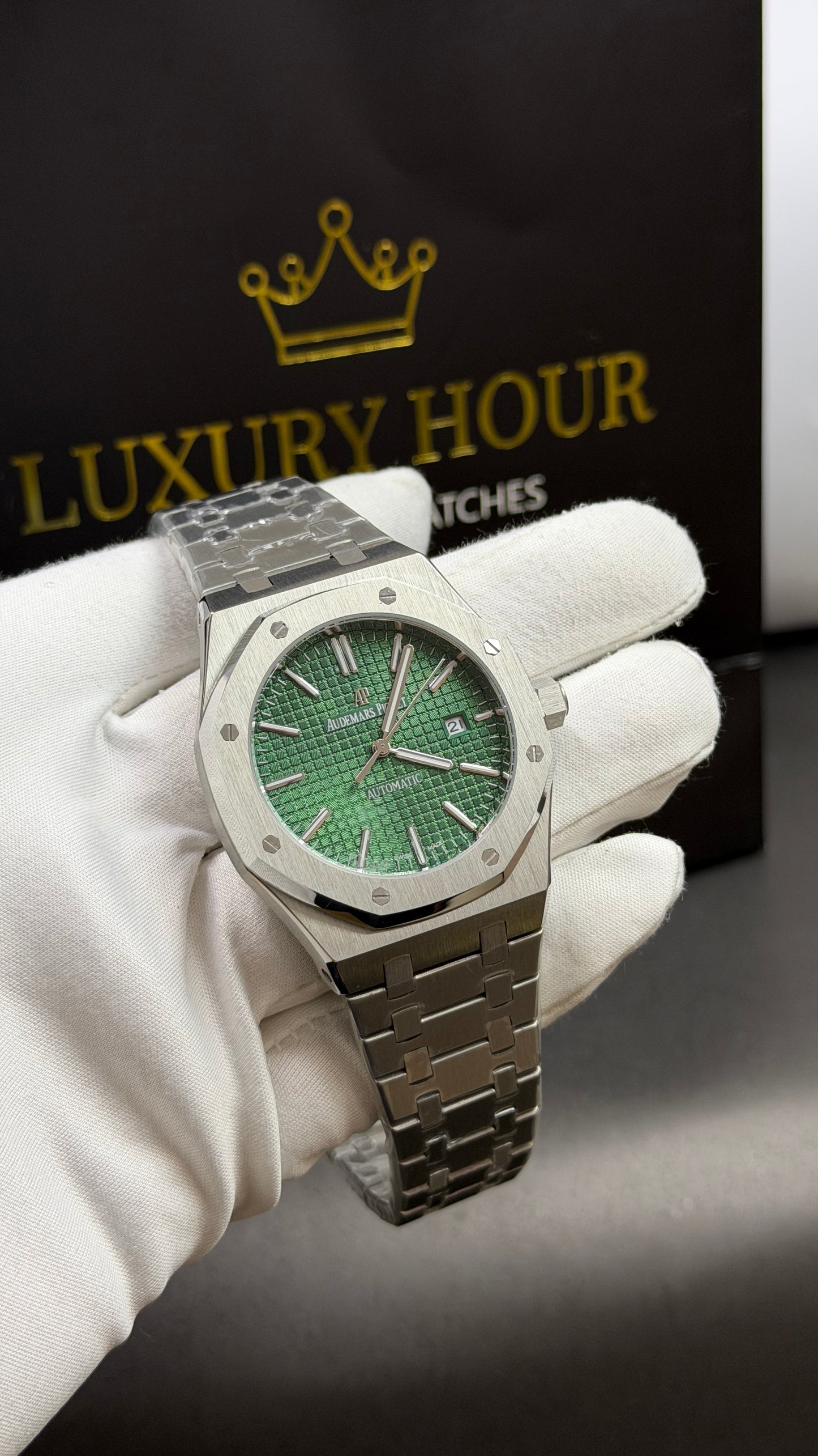 Silver with Green Dial.