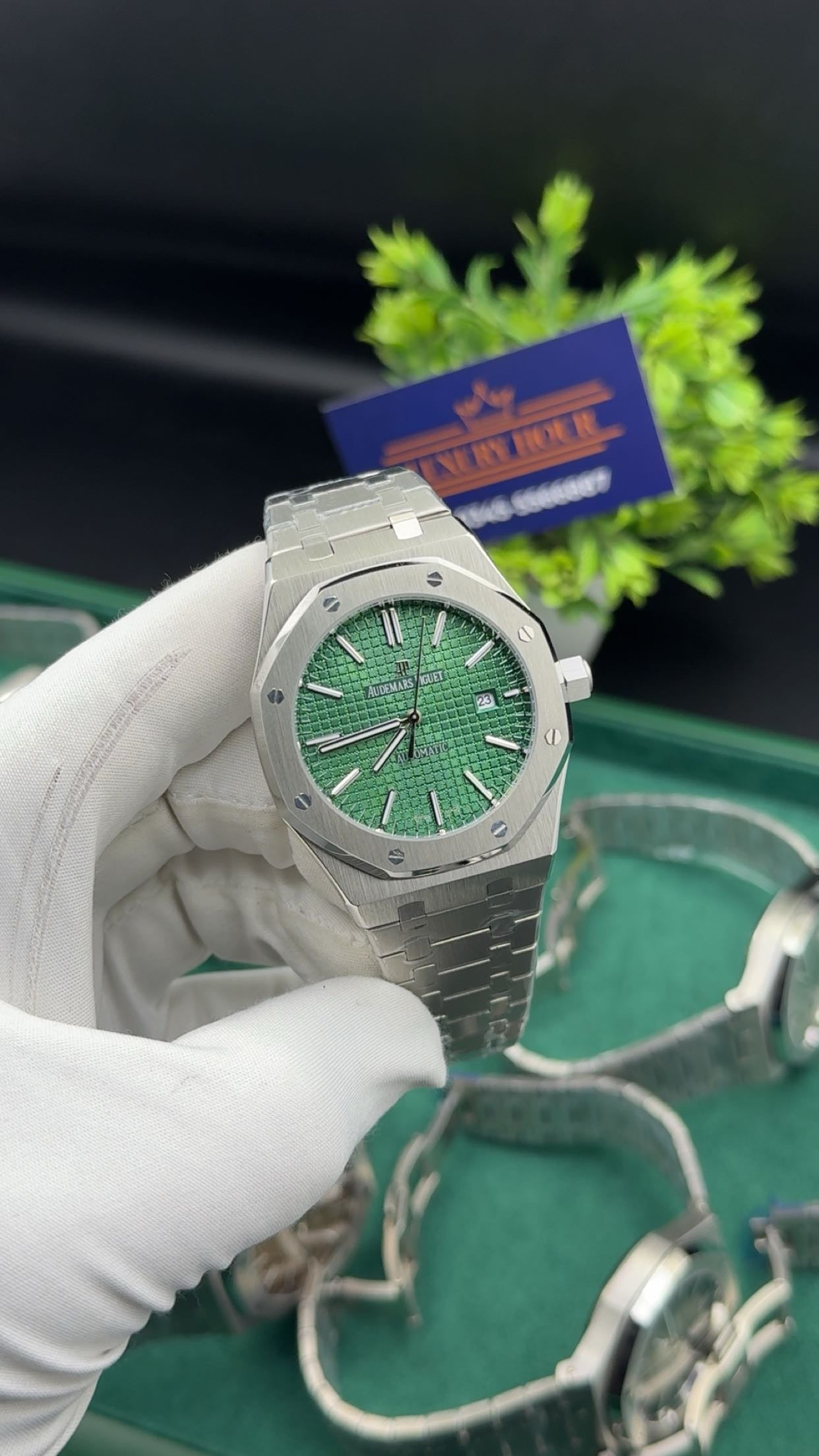 Silver with green dial