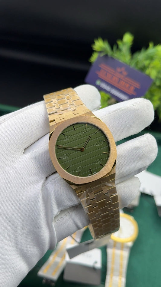 Yellow gold with green dial