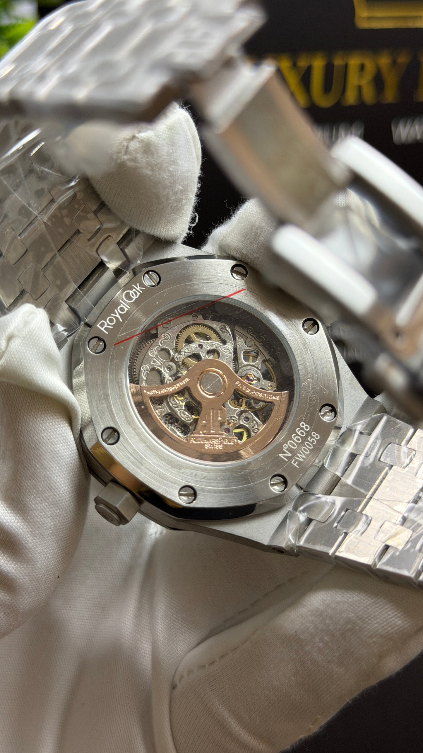 Silver with Orange Skeleton Dial.