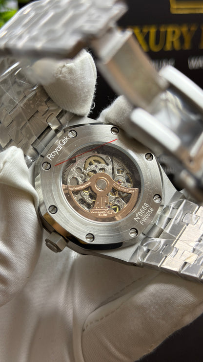 Silver with Orange Skeleton Dial.