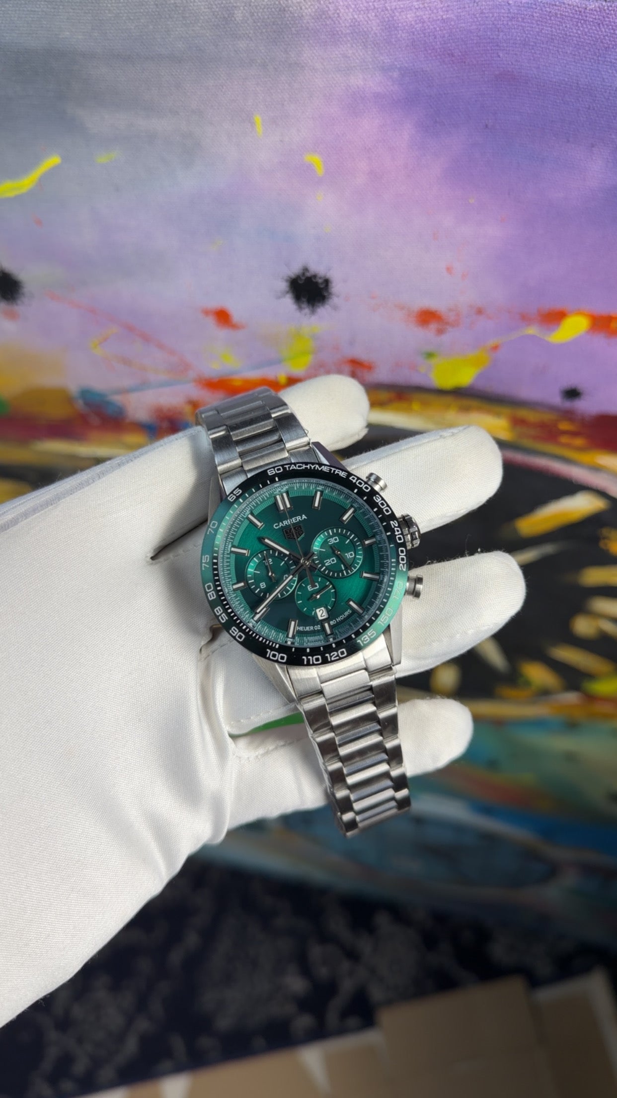 Silver with green dial