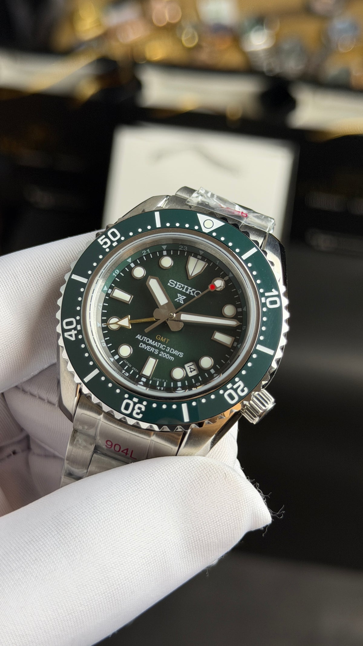 Silver with Green Dial.