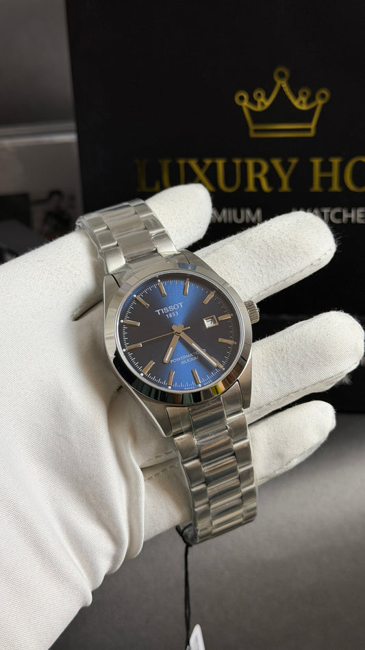 Silver with Aqua Dial.