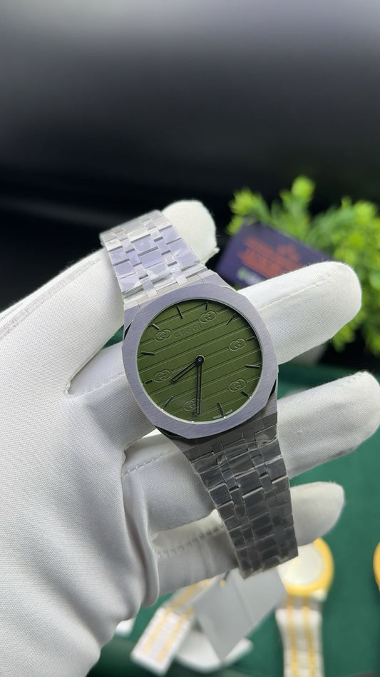 Silver with green dial