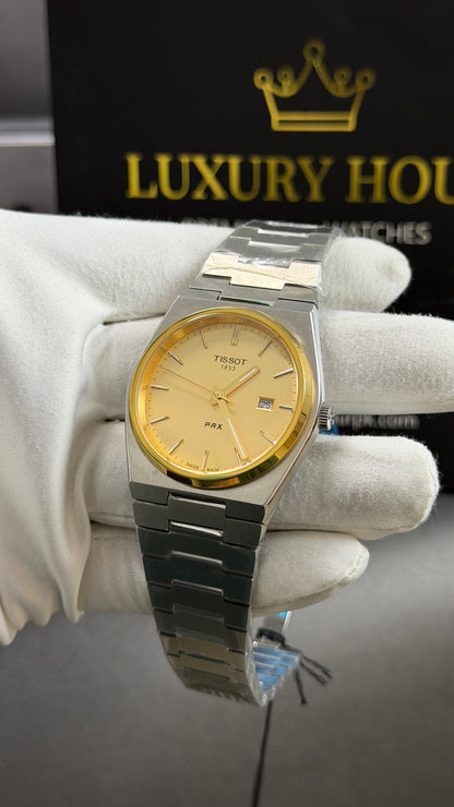 Silver with Yellow Gold Dial.