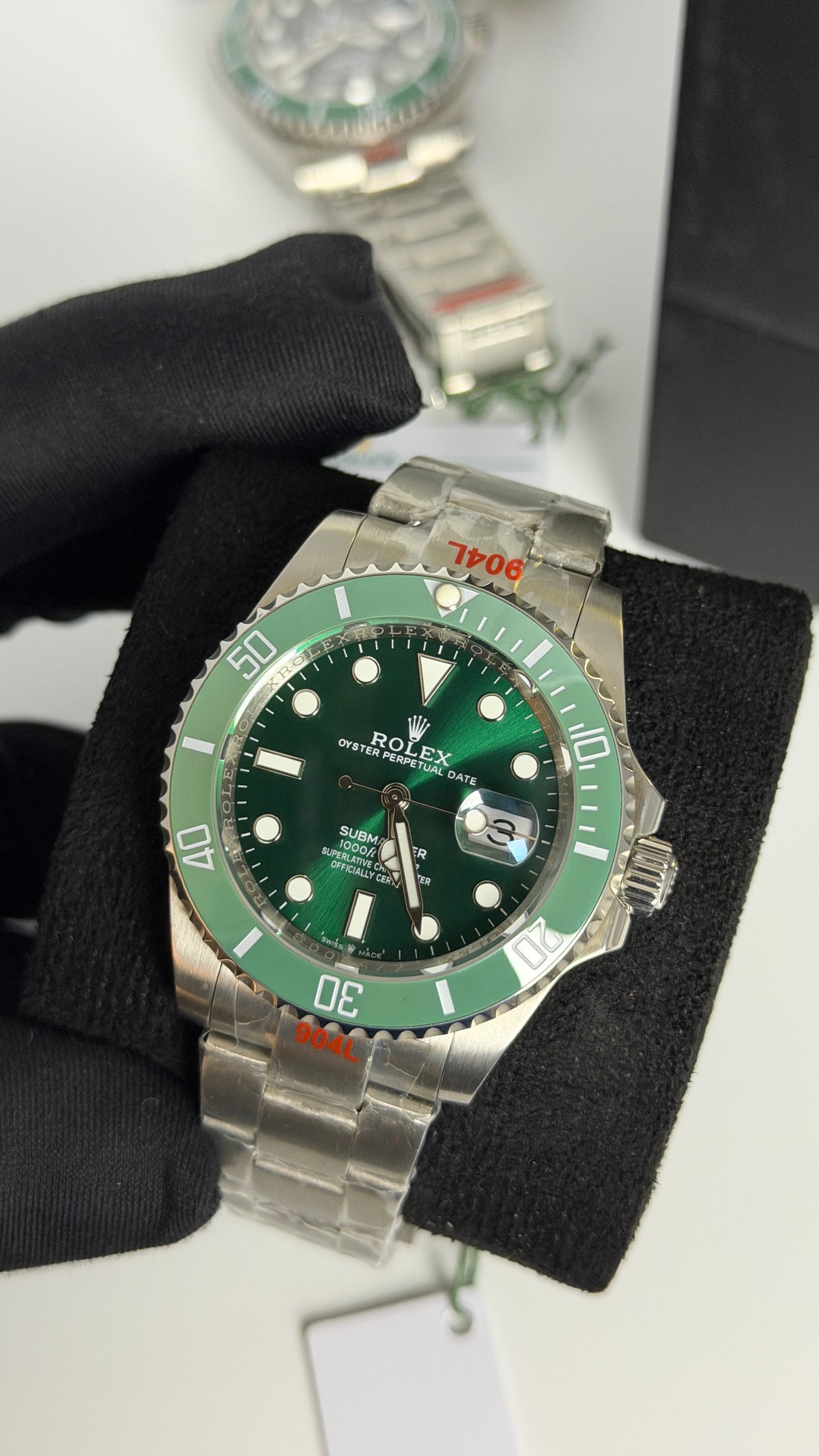 Silver With Green Dial.