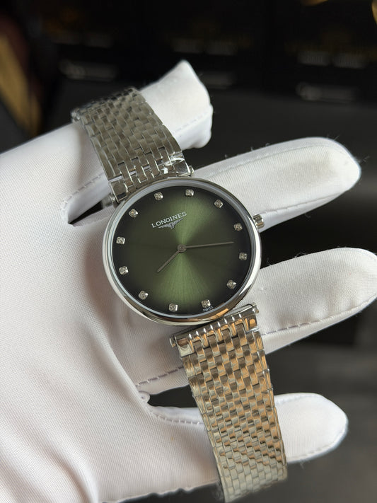 Silver with Green Dial.