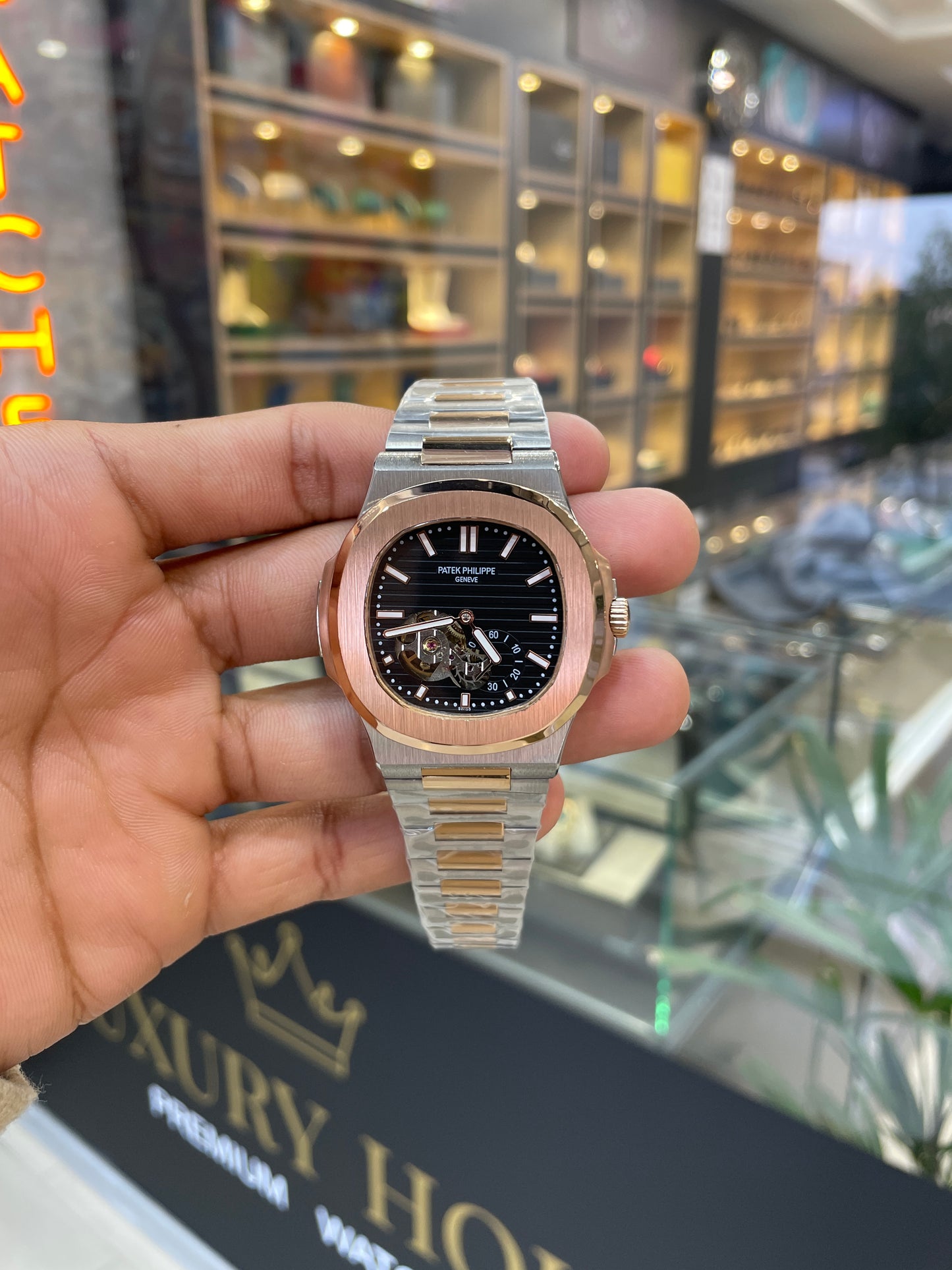 Rose gold two tone with black dial