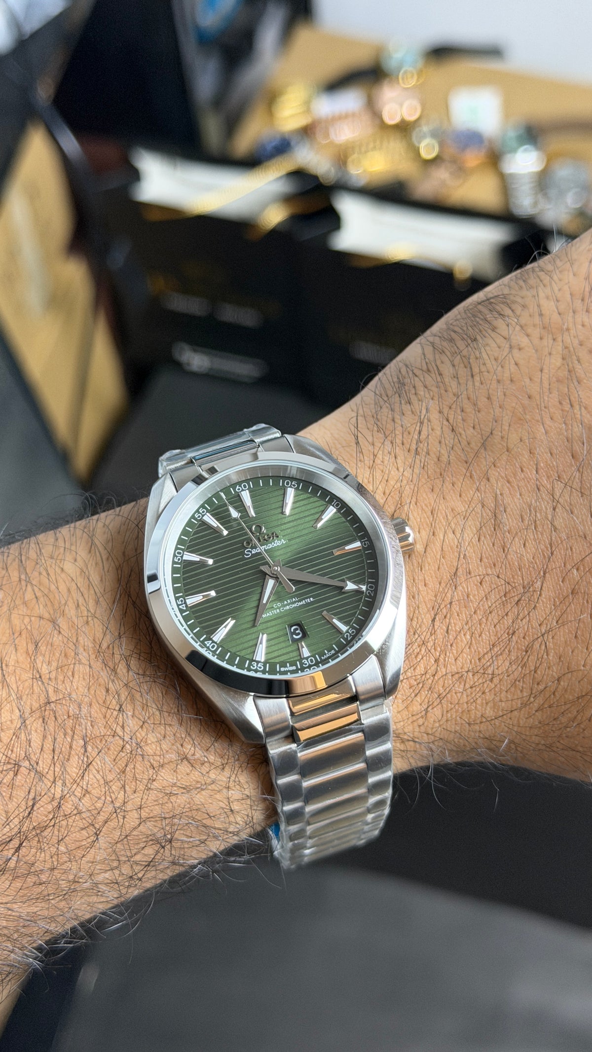 Silver with Green Dial.