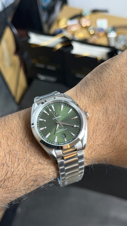 Silver with Green Dial.