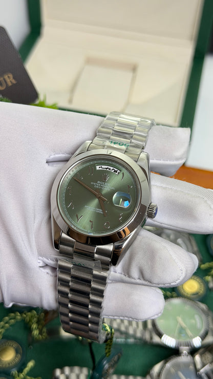 Silver with Green Dial.