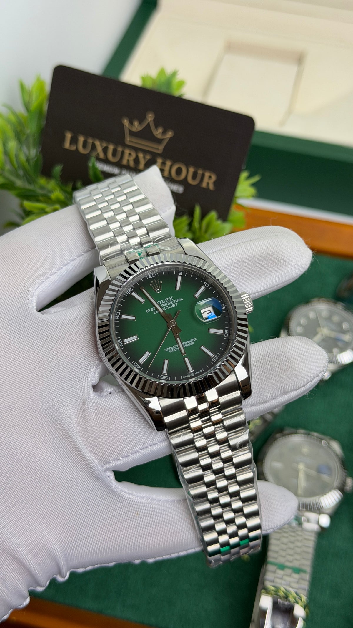 Silver with Green Dial.