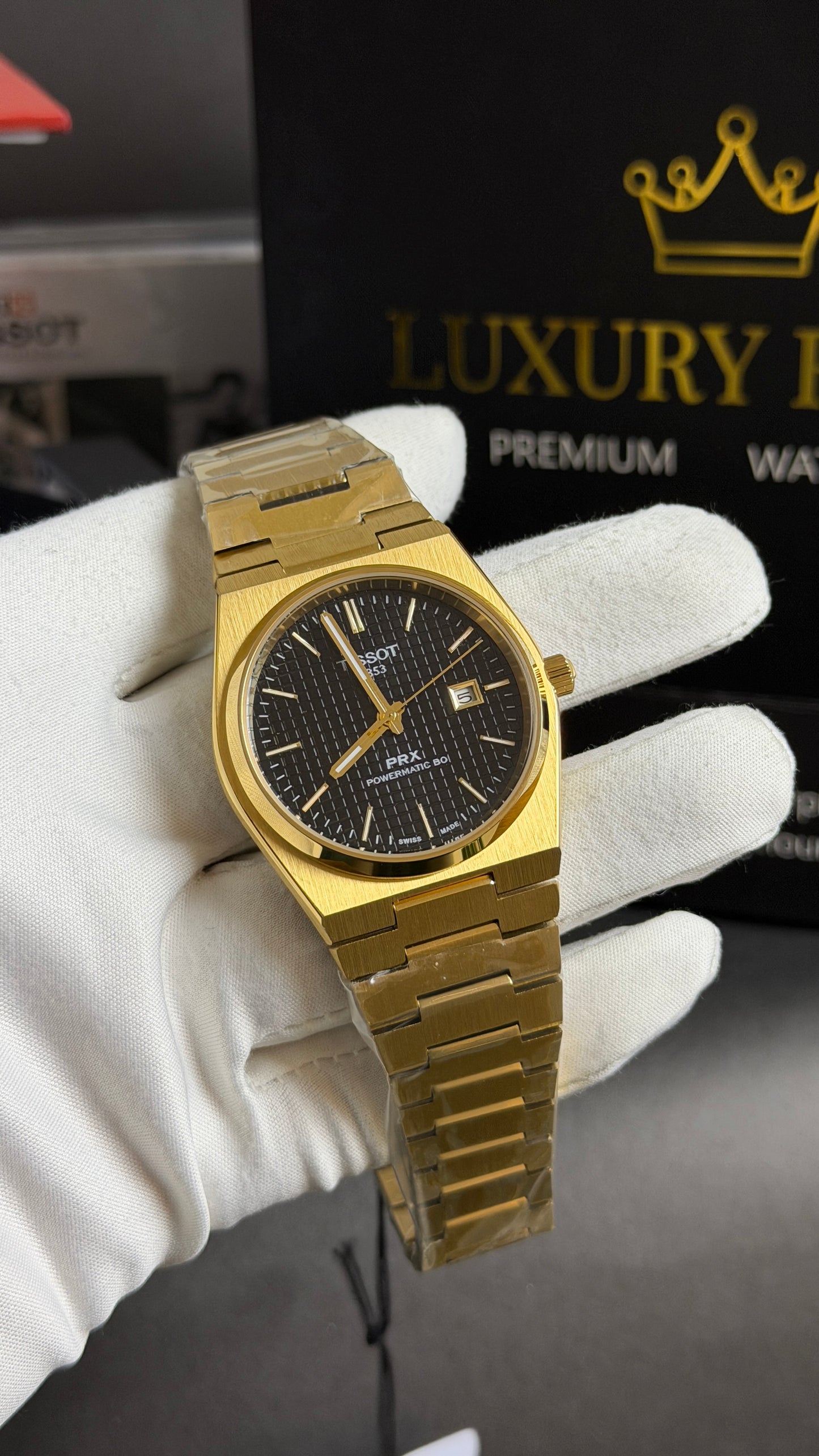 Yellow Gold with Black Dial.