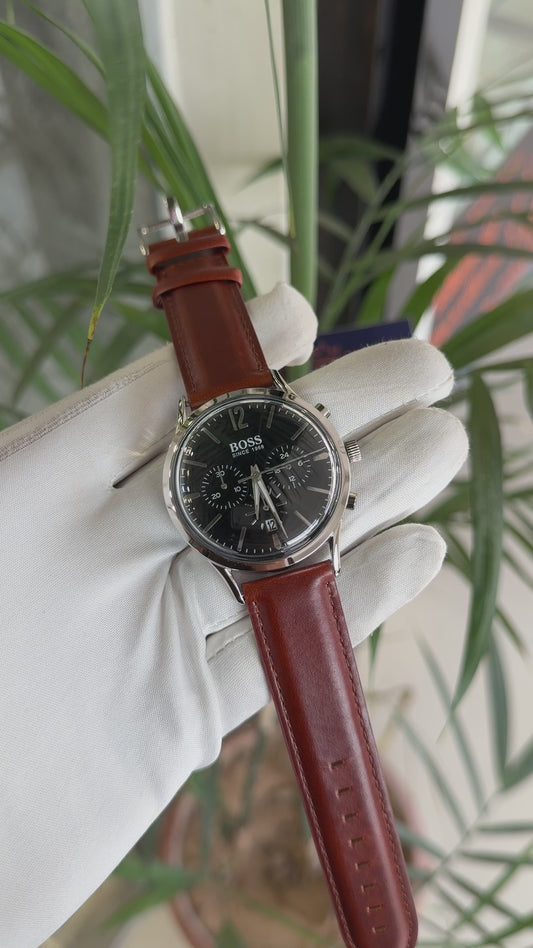 Silver with black dial and brown strap