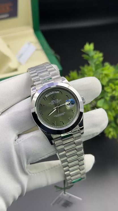 Silver with green arabic dial