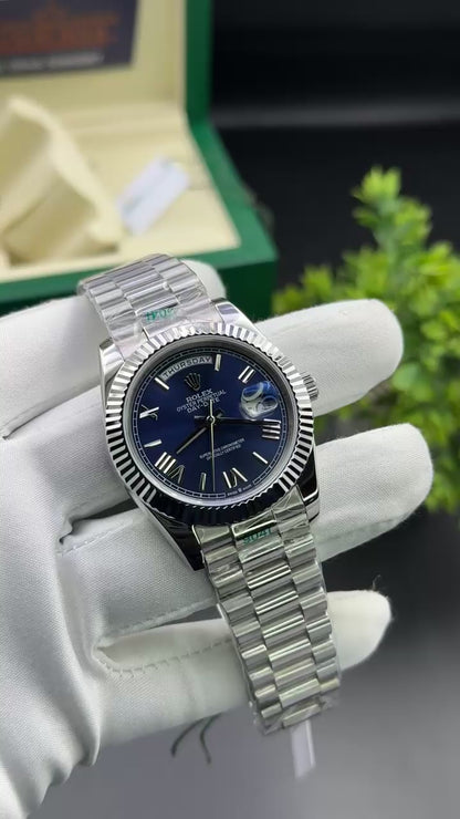 Silver with blue dial