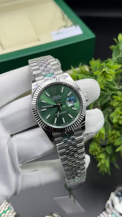 Silver with green dial
