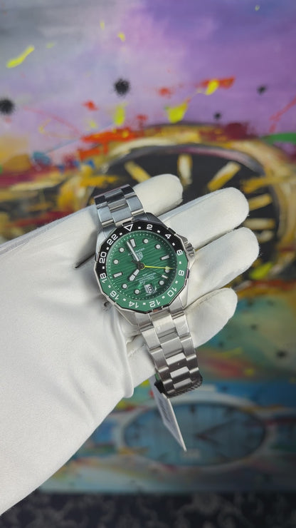 Silver with green dial