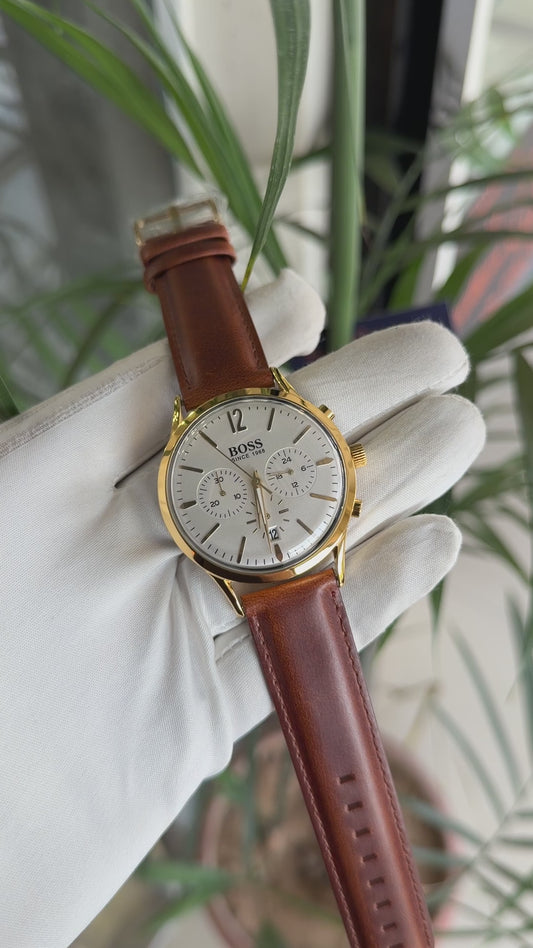 Yellow gold with white dial and brown strap