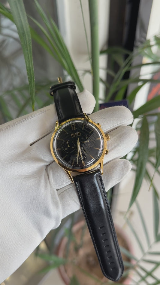 Yellow gold with black dial and black strap