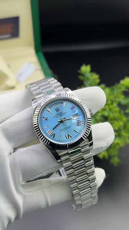 Silver with sky blue dial