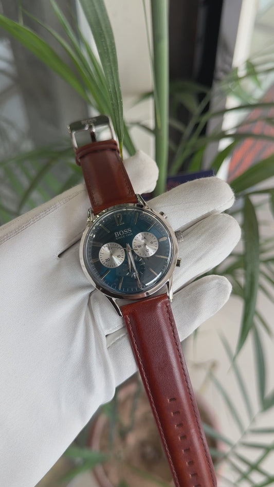 Silver with blue dial and brown strap